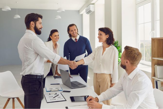 Business man closing a deal with a handshake